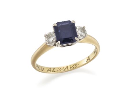 An 18ct gold, sapphire and diamond three stone ring, the emerald-cut sapphire with brilliant-cut diamond shoulders, to a plai