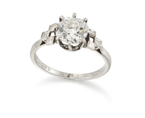 A platinum single stone diamond ring with diamond shoulders, with an old brilliant-cut diamond, with an estimated weight of a