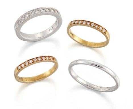 Four rings, comprising: an 18ct white gold court section band ring, Sheffield hallmarks, width 2mm, ring size R; a brilliant-