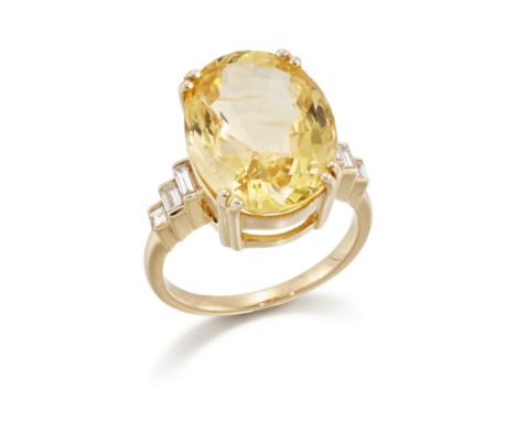 A yellow sapphire and diamond ring, the oval mixed cut yellow sapphire with an estimated weight of approximately 20.50 carats
