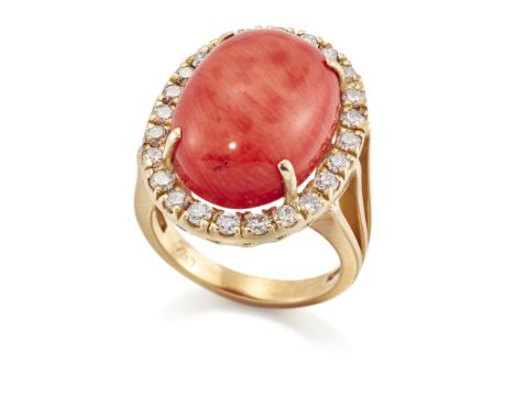 A stained coral and diamond ring, the single cabochon coral (corallium rubrum) in claw-set mount, with brilliant-cut diamond 