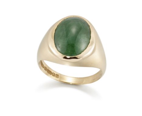 An 18ct gold single stone jadeite jade ring, the oval jadeite jade cabochon, rubover set, to tapered shoulders and a plain ho