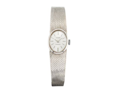 Swiss. An 18ct white gold manual wind bracelet watch Circa 1970 Manual wind Swiss 17 jewel movement, silvered dial with appli