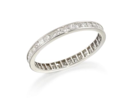 A princess cut diamond full eternity ring, the princess-cut diamonds in channel setting to plain guards, width 2.2mm, ring si