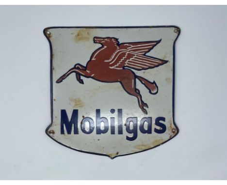 Shield-shaped small-format with distinctive red “Pegasus” flying horse motif. Light age-wear and fading. 34cm x 31cm.Click he