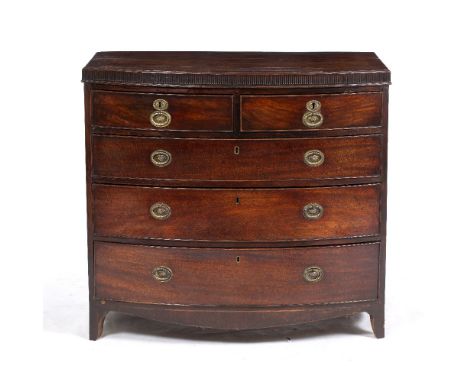 A 19TH CENTURY MAHOGANY BOW FRONTED CHEST OF TWO SHORT AND THREE LONG DRAWERS with oval brass handles and bracket feet, 28cm 