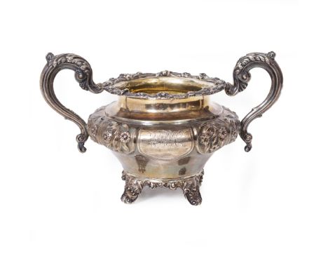 A WILLIAM IV SILVER SUGAR BOWL with embossed floral decoration and coat of arms, bearing marks for London 1837, 23cm x 14.5cm