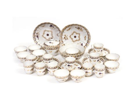 AN 18TH CENTURY WORCESTER OR CAUGHLEY PORCELAIN PART TEA AND COFFEE SERVICE consisting of two bread and butter plates, a slop