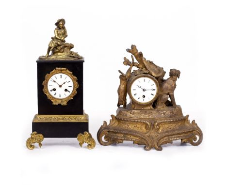 A CONTINENTAL BLACK SLATE AND CAST BRASS MOUNTED MANTLE CLOCK with enamel dial, the movement striking the hours and half hour