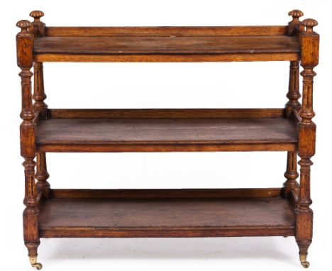 A VICTORIAN OAK THREE TIER BUFFET TABLE with turned and fluted supports, 118cm wide x 46cm deep x 103cm high At present, ther