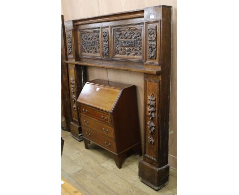 An early 20th century carved oak fire surround, from a house in Brunswick square Brighton W.188cm H.182cm