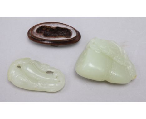 Two Chinese pale celadon jade carvings, the first a fish and a gourd, the second a bat and bitter melons, 4.9cm and 4.8cm