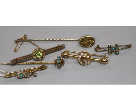 An 18ct gold and seed pearl bar brooch, a 9ct bar brooch, two other yellow metal bar brooches and two stick pins.