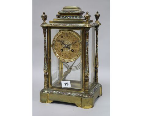An enamel four glass clock with mercury pendulum