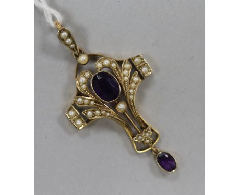 An Edwardian 9ct gold, amethyst and seed pearl pendant, overall 48mm.