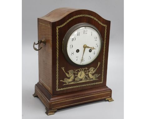 An Edwardian inlaid mahogany mantel clock, decorated with fauns, Mougin movement striking on a gong, 30cm