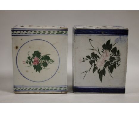 TWO ORIENTAL CERAMIC PILLOWS, of typical form in mainly blue and white, H 13.75 cm