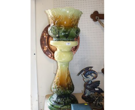 A LARGE CERAMIC JARDINIERE AND STAND
