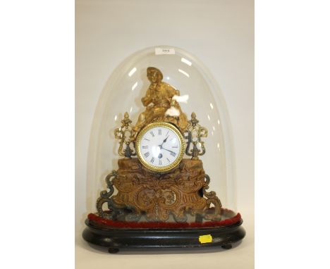 A 19TH CENTURY GILT METAL CONTINENTAL MANTEL CLOCK UNDER A GLASS DOME, with figurative surmount, H 32 cm (excluding plinth)