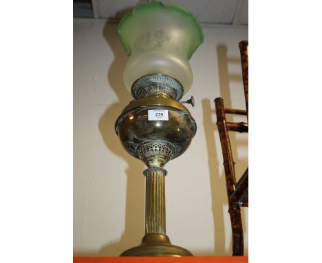 A BRASS COLUMN OIL LAMP WITH GLASS SHADE 