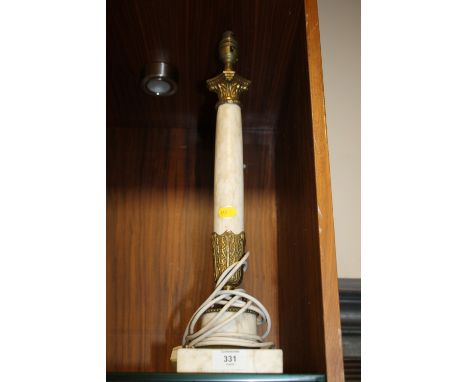 A MARBLE TABLE LAMP BASE WITH BRASS DETAIL 