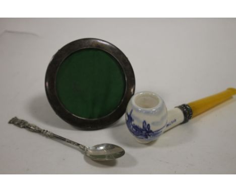 A HALLMARKED SILVER MINIATURE PICTURE FRAME TOGETHER WITH A SILVER MOUNTED PIPE AND A SPOON