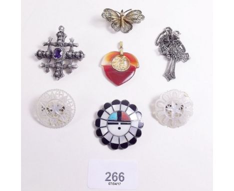 A box of Eastern jewellery including silver Jerusalem brooch and white metal filigree crucifix 