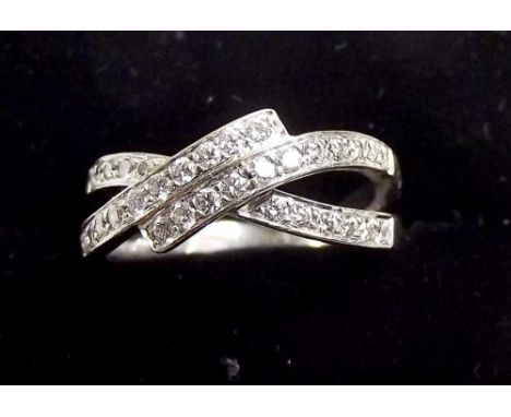 An 18ct gold split crossover ring half set diamonds , size N