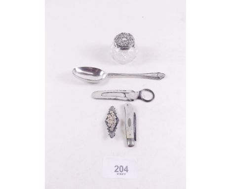 A silver topped and cut glass patch box, fruit knife, bookmark, brooch and tea spoon