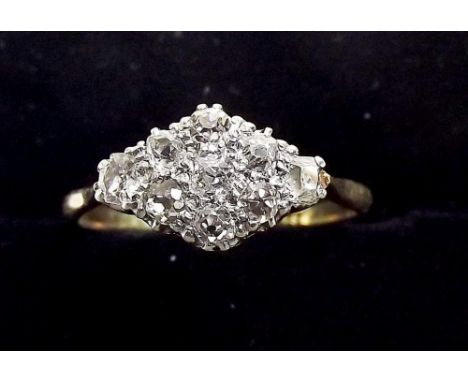 An 18ct gold ring set diamonds in lozenge form plaque , size P