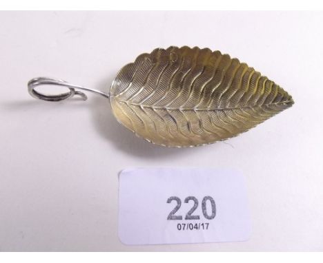 A silver gilt leaf form caddy spoon - London 1802 by EM