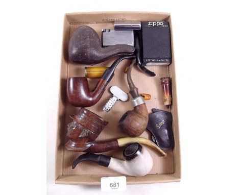 A box of old pipes including carved wood pipe of General Petain and three lighters 