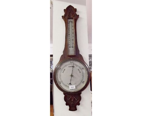 A Wallace Allan oak cased barometer thermometer with carved decoration 