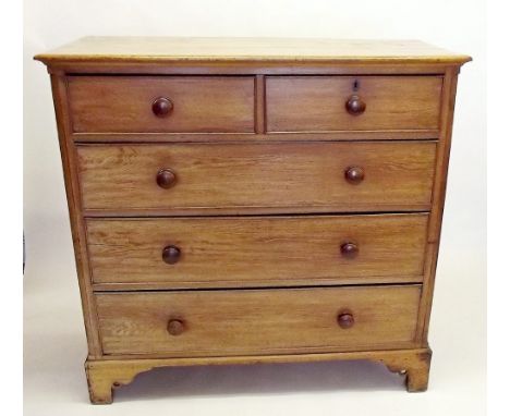 A large Victorian light oak chest of two short and three long drawers all raised on bracket supports , 127cm wide