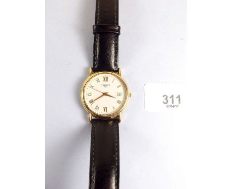An 18 carat gold Tissot gentleman's wrist watch - with battery movement, appears to be working