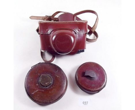 Two old surveyors tape measures and an old camera 
