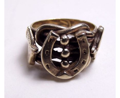 A heavy 9ct gold gents ring decorated horseshoe and horse's heads, 11g approx. 