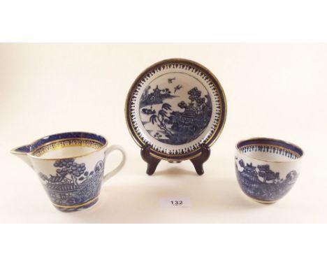 An 18th century Caughley teabowl and saucer printed Pagoda pattern, slight wear to gilt, S mark to base and a similar jug - s