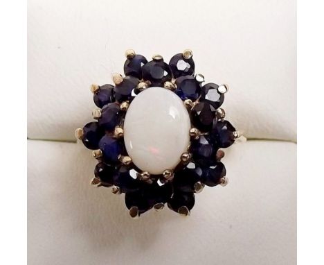 A 9ct gold opal and sapphire ring - size N