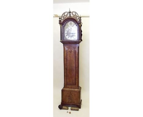 An eight day longcase clock with brass dial, date niche and seconds dial by Richard Simpson of Yarmouth with pierced fretwork