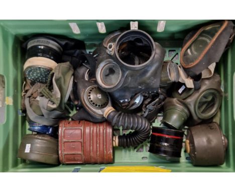 Box containing collection of vintage WWII period gas masks and air filters. (B.P. 21% + VAT)