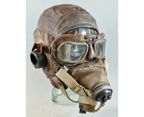 British leather flying helmet with oxygen mask marked 'AM, 10A 12570' and a pair of British classic Aviator goggles.(Mannequi