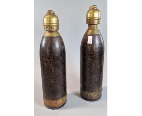 Two Boer War period heavy&nbsp; shells with brass fuses. 26cm long approx. (2) (B.P. 21% + VAT)&nbsp;&nbsp;Bases have F, S, V