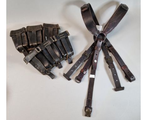 Two German probably WWI three section ammunition pouches, together with a set of German metal mounted Military braces. (B.P. 