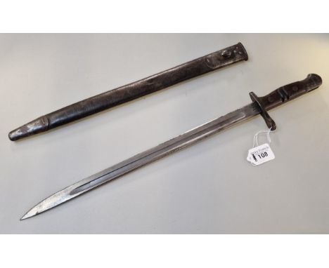 US Remington WWI period bayonet dated 1913, having wooden scales and single edge fullered blade, in metal mounted leather sca