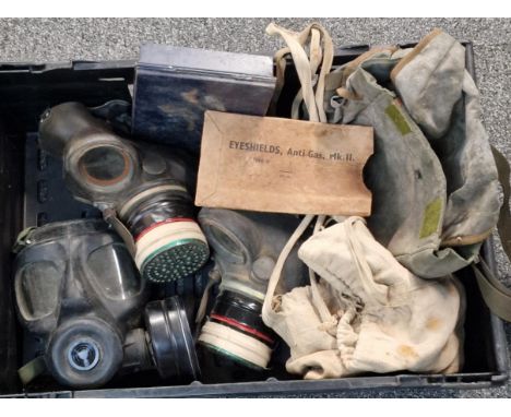 Box containing two WWII period and one British Army S6 gas masks with satchels. (B.P. 21% + VAT)
