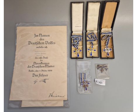 Five German Reich style Mutterkreuz (Honour Crosses), two First Class in gold in original cases, one Second Class in silver i