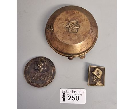 Brass Third Reich design circular snuff/compact with SS runes together with bronzed Eleventh Olympiad Berlin 1936 badge Kampe