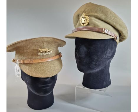 Two WWI Officer's caps, one with badge for Queen's Own Yeomanry, the other cap badge bearing initials GRJ or I. (2) (Mannequi