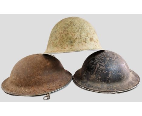 Collection of three British helmets, to include two Brodie helmets and one MK IV 'Turtle' helmet. (3) (B.P. 21% + VAT) Black 